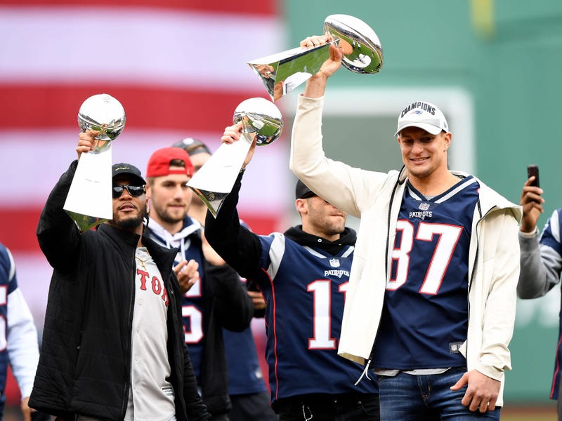 Rob Gronkowski holds up a Lombardi Trophy
