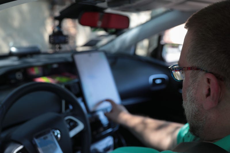 Kenneth Martinson checks his driving apps before starting to work in Palm Springs during the first weekend of Coachella, April, 13, 2019.