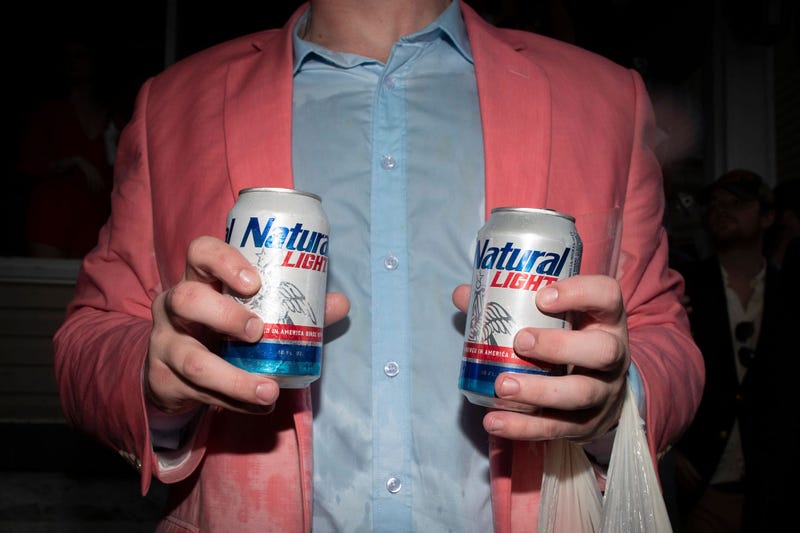Guy Holding Natural Light Beer