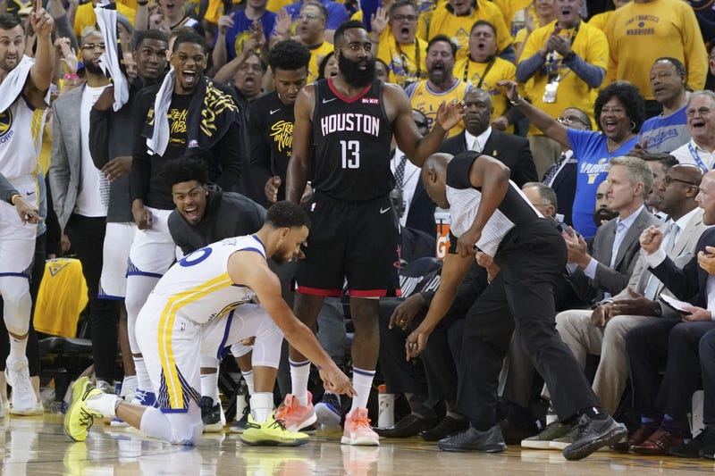 Golden State Warriors guard Stephen Curry (30) and NBA referee Courtney Kirkland (61) point after Houston Rockets guard James Harden (13) stepped out of bounds during the fourth quarter in game one of the second round of the 2019 NBA Playoffs at Oracle Ar
