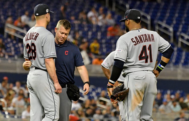 May 1, 2019; Miami, FL, USA; A member of the Cleveland Indians medical staff checks on starting pitcher Corey Kluber (28) after he was struck in the arm by a ball in the fifth inning H\ at Marlins Park. Mandatory Credit: Jasen Vinlove-USA TODAY Sports
