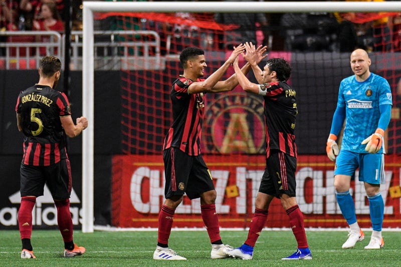 Atlanta United Defenders Leando Gonzalez Pirez, Miles Robinson, and Michael Parkhurst, and Goalie Brad Guzan