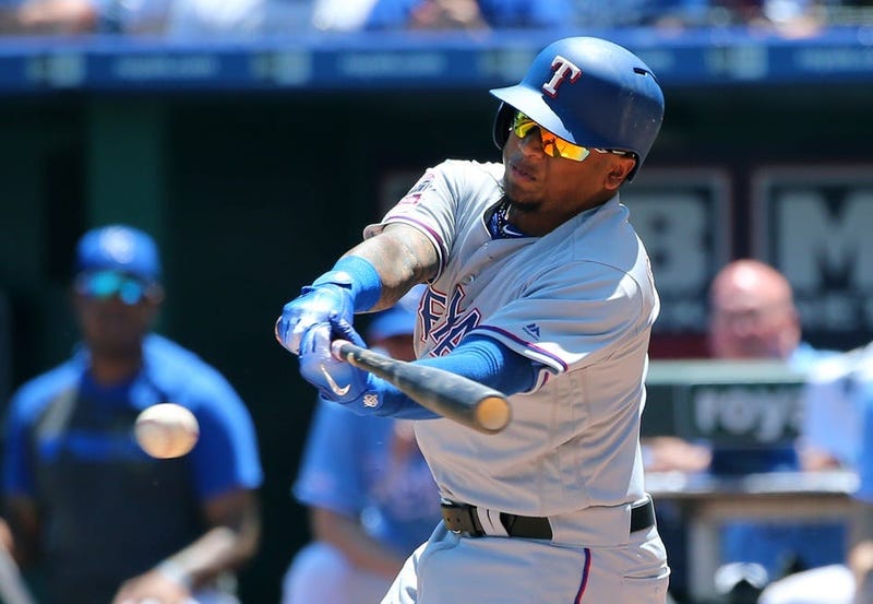 May 16, 2019; Kansas City, MO, USA; Texas Rangers left fielder Willie Calhoun (5) hits an RBI single against the Kansas City Royals in the fifth inning at Kauffman Stadium.