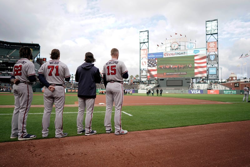 May 20, 2019; San Francisco, CA, USA; Atlanta Braves starting pitcher Touki Toussaint (62) and relief pitcher Jacob Webb ()71 and shortstop Charlie Culberson (second from right) and starting pitcher Sean Newcomb (15) stand for the National Anthem before a