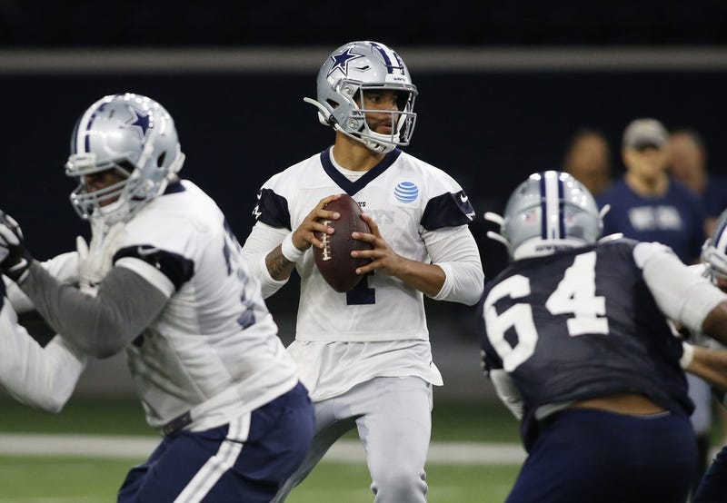 Jun 11, 2019; Frisco, TX, USA; Dallas Cowboys quarterback Dak Prescott (4) goes through a drill during practice at the Ford Center at the Star in Frisco