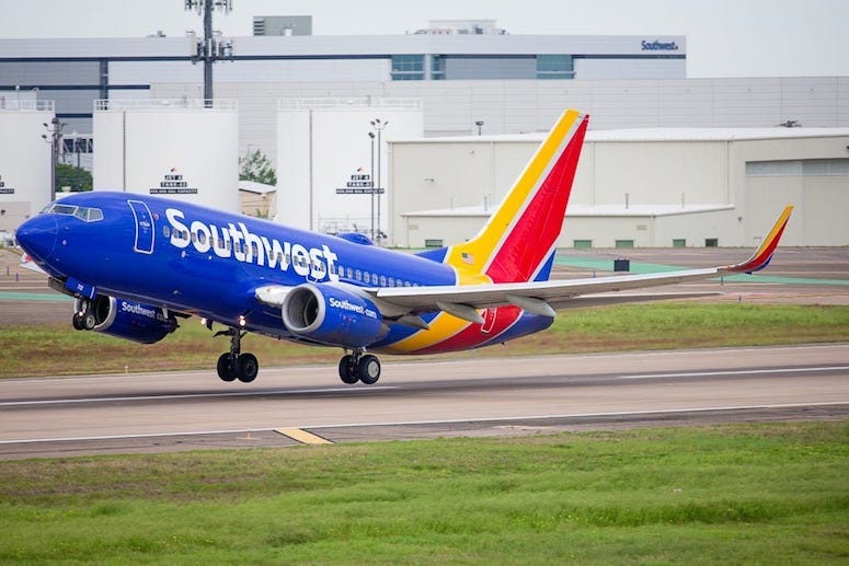 southwest airlines, southwest, fight attendant, overhead bin, hiding