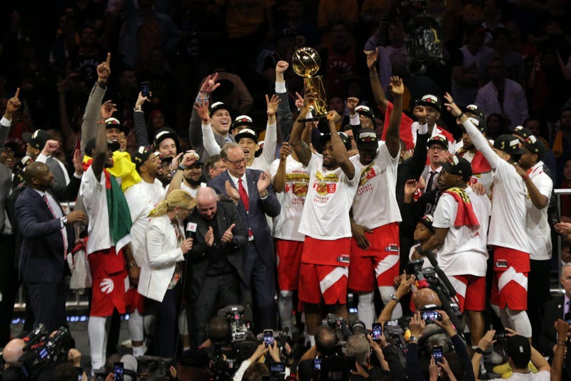 Jun 13, 2019; Oakland, CA, USA; Toronto Raptors forward Kawhi Leonard (2) lifts up the Larry O'Brien Championship Trophy after defeating Golden State Warriors for the NBA Championship in game six of the 2019 NBA Finals