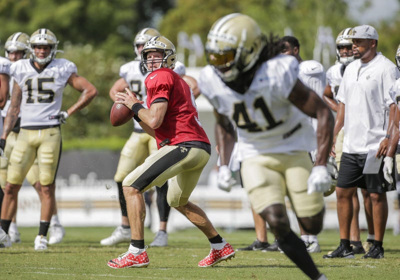 Jul 28, 2019; Metairie, LA, USA; New Orleans Saints quarterback Drew Brees (9) throws to running back Alvin Kamara (41) during training camp at the Ochsner Sports Performance Center.