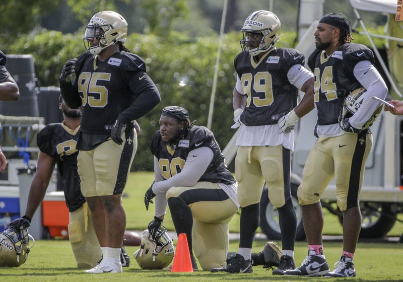 Jul 28, 2019; Metairie, LA, USA; New Orleans Saints defensive tackle Taylor Stallworth (95) and defensive tackle Malcom Brown (90) and defensive end Geneo Grissom (99) and defensive end Cameron Jordan (94) look on during training camp at the Ochsner Sport