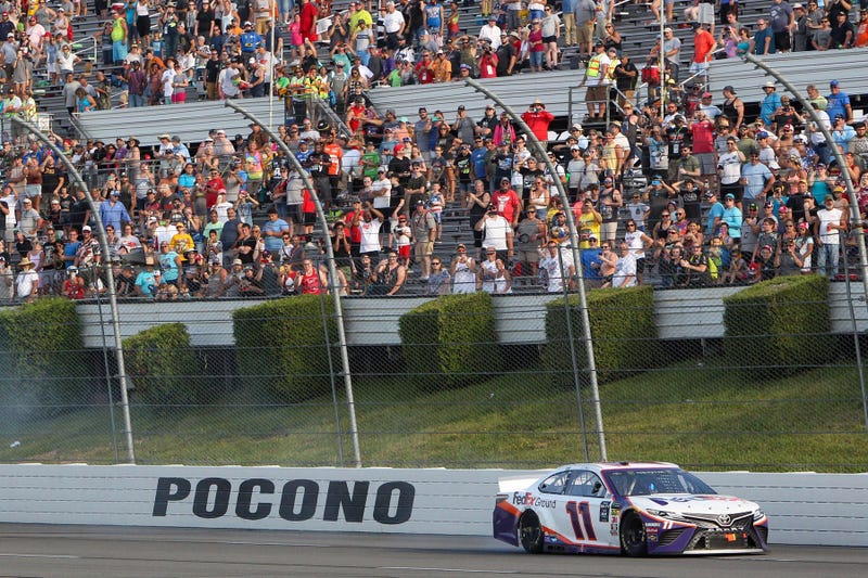 NASCAR Cup Series driver Denny Hamlin (11) celebrates after winning the Gander RV 400 at Pocono Raceway.