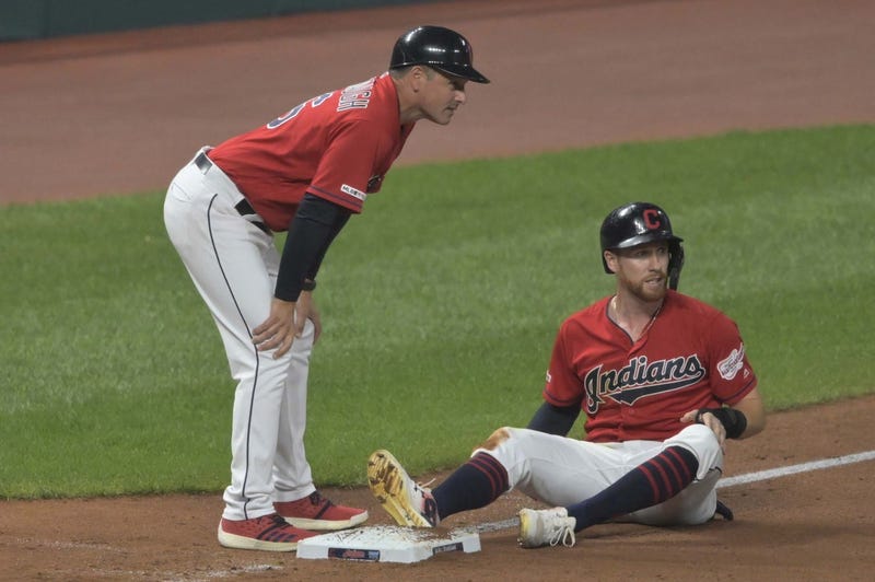 Aug 5, 2019; Cleveland, OH, USA; Cleveland Indians left fielder Jordan Luplow (8) reacts beside third base coach Mike Sarbaugh (16) after he was injured while stealing third base in the seventh inning against the Texas Rangers leat Progressive Field. Mand