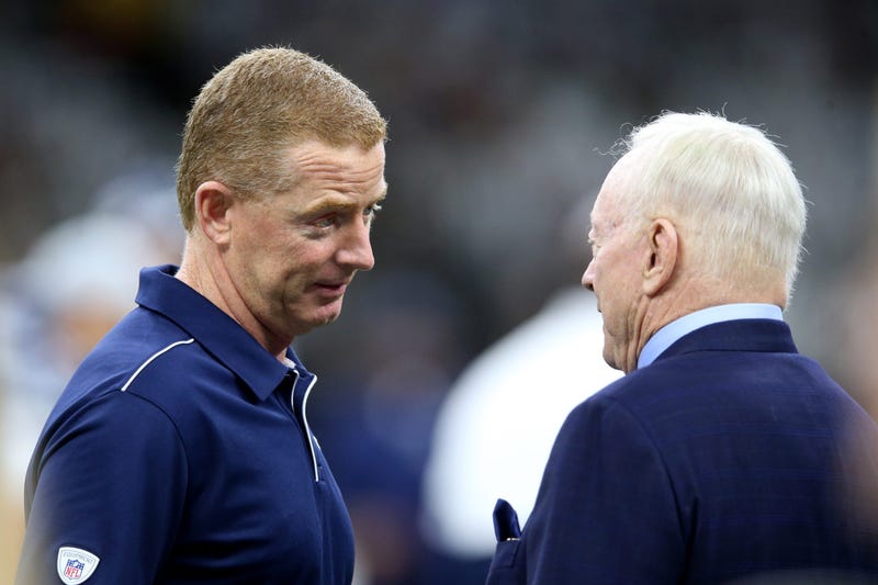 Dallas Cowboys head coach Jason Garrett talks to team owner Jerry Jones