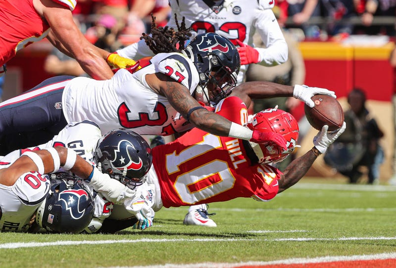 Oct 13, 2019; Kansas City, MO, USA; Kansas City Chiefs wide receiver Tyreek Hill (10) catches a pass for a touchdown against Houston Texans cornerback Phillip Gaines (29) and strong safety Justin Reid (20) and strong safety Jahleel Addae (37) during the f