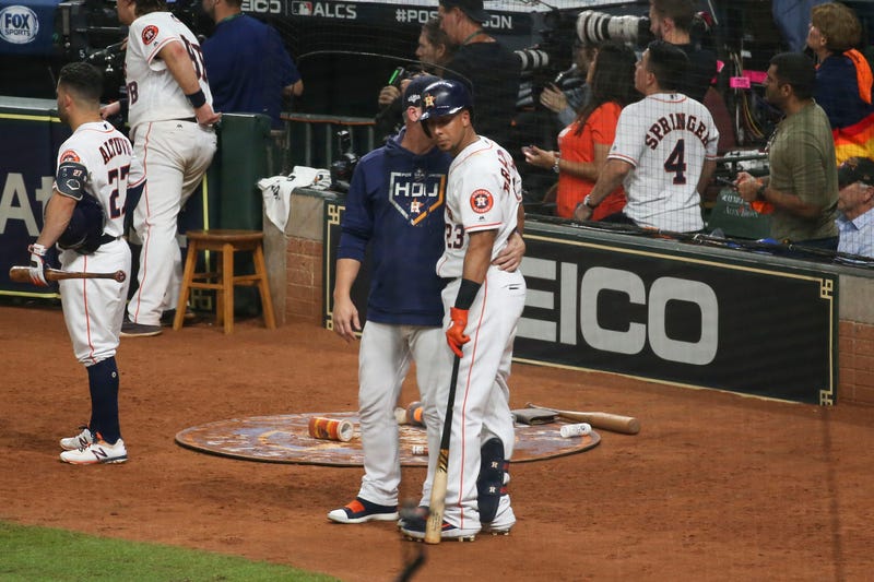 Oct 13, 2019; Houston, TX, USA; Houston Astros left fielder Michael Brantley (23) is visited by manager AJ Hinch (14) after Brantley hit a security guard with a foul ball in the fifth inning in game two of the 2019 ALCS playoff baseball series against the