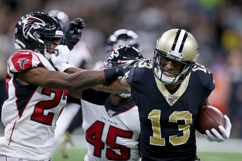 New Orleans Saints wide receiver Michael Thomas (13) pushes Atlanta Falcons strong safety Damontae Kazee (27) away by his facemark in the second quarter at the Mercedes-Benz Superdome. Thomas was called for a facemark penalty.