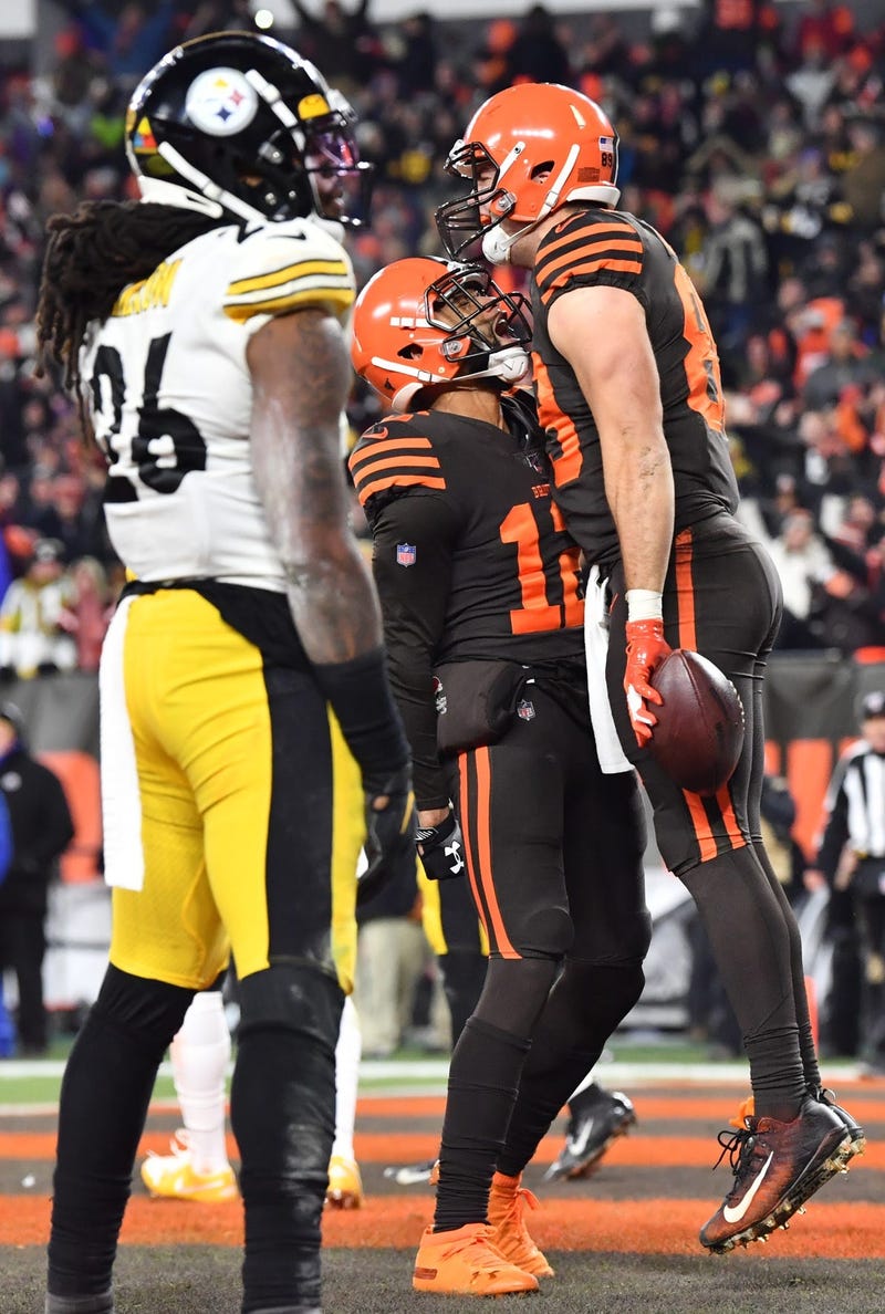 Cleveland Browns tight end Stephen Carlson (89) and wide receiver KhaDarel Hodge (12) celebrate after Carlson caught a touchdown over the defense of Pittsburgh Steelers inside linebacker Mark Barron (26) during the fourth quarter at FirstEnergy Stadium.