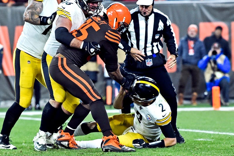 Nov 14, 2019; Cleveland, OH, USA; Cleveland Browns defensive end Myles Garrett (95) hits Pittsburgh Steelers quarterback Mason Rudolph (2) with his own helmet as offensive guard David DeCastro (66) tries to stop Garrett