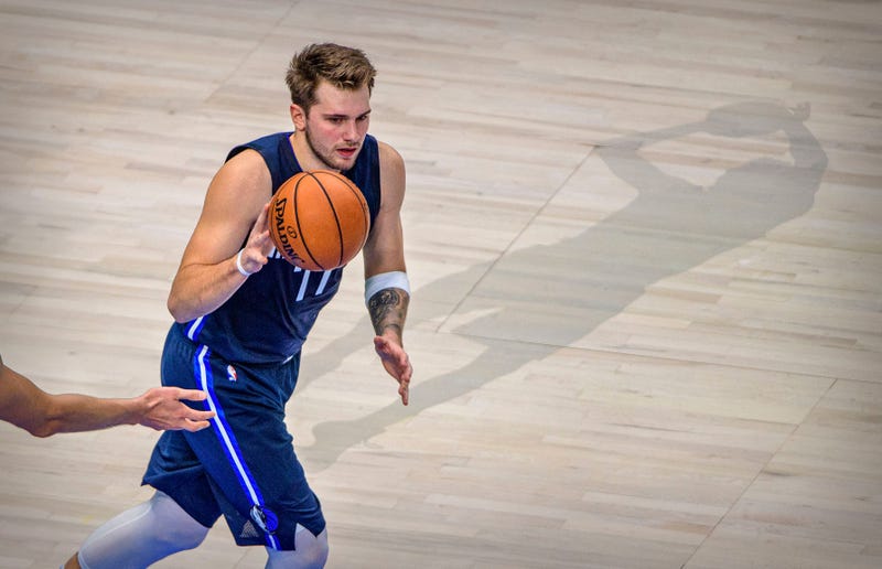 Luka Doncic brings the ball up the court