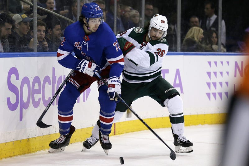 Mats Zuccarello and Filip Chytil and the puck