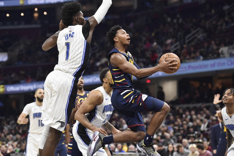 Nov 27, 2019; Cleveland, OH, USA; Cleveland Cavaliers guard Darius Garland (10) drives against Orlando Magic forward Jonathan Isaac (1) in the third quarter at Rocket Mortgage FieldHouse. Mandatory Credit: David Richard-USA TODAY Sports