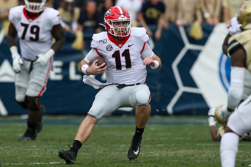 Nov 30, 2019; Atlanta, GA, USA; Georgia Bulldogs quarterback Jake Fromm (11) scrambles against the Georgia Tech Yellow Jackets in the first half at Bobby Dodd Stadium. Mandatory Credit: Brett Davis-USA TODAY Sports