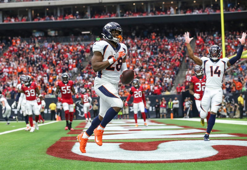 Denver Broncos running back Royce Freeman (28) scores a touchdown during the second quarter against the Houston Texans at NRG Stadium.