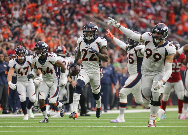Denver Broncos strong safety Kareem Jackson (22) celebrates with teammates after an interception during the fourth quarter against the Houston Texans at NRG Stadium.