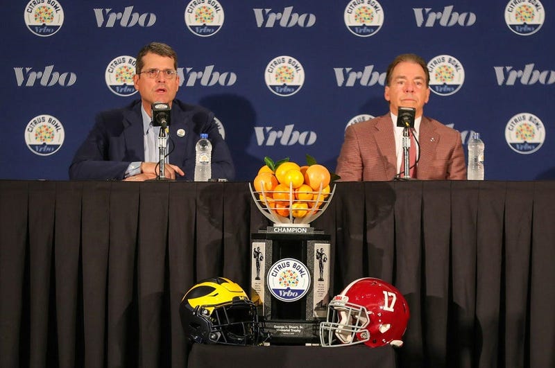 Michigan head coach Jim Harbaugh and Alabama head coach Nick Saban