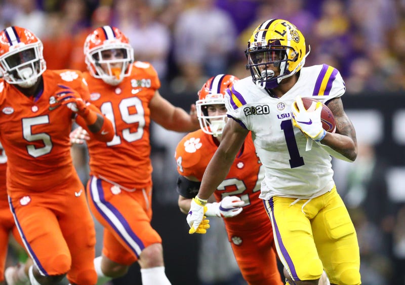 LSU Tigers wide receiver Ja'Marr Chase (1) runs with the ball against the Clemson Tigers in the fourth quarter in the College Football Playoff national championship game at Mercedes-Benz Superdome.