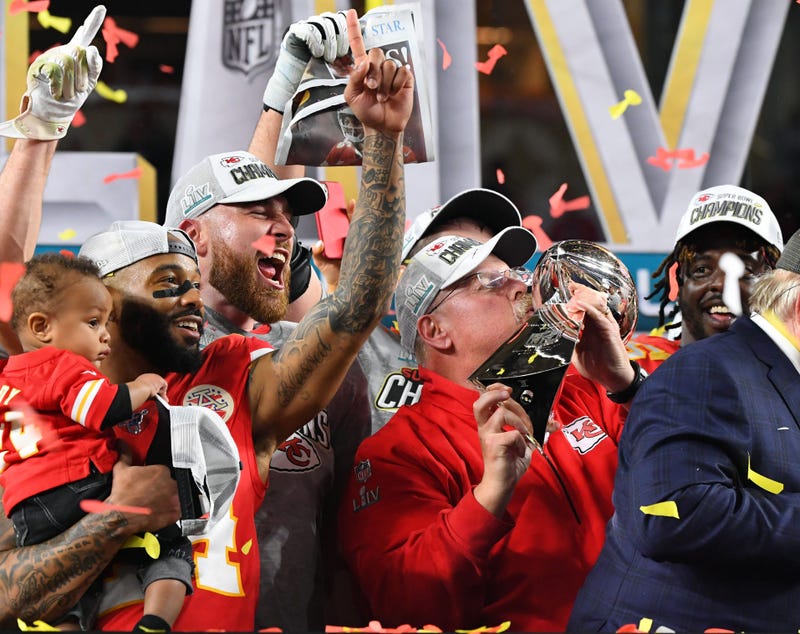 Kansas City Chiefs head coach Andy Reid hoist the Lombardi Trophy.