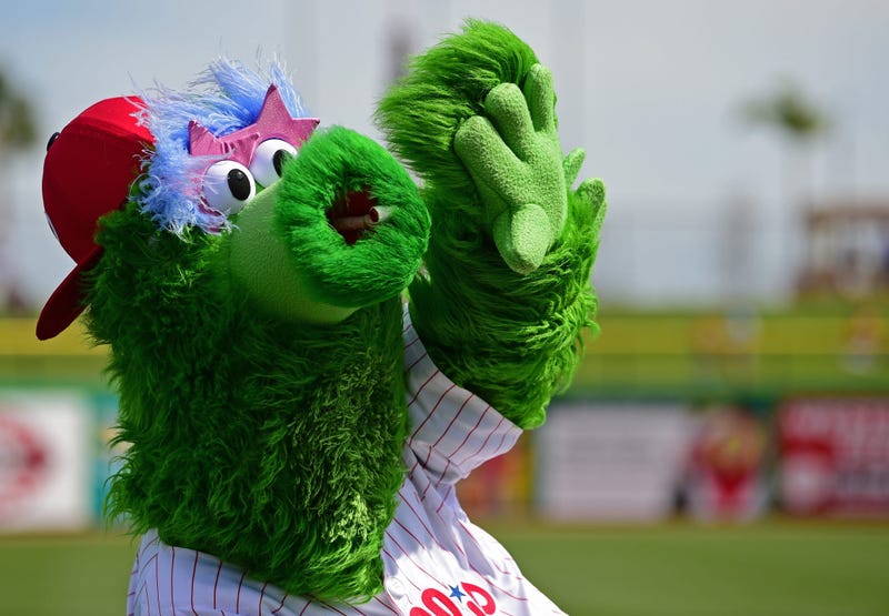 Philadelphia Phillies mascot the Phillie Phanatic waives to fans before a game between the Baltimore Orioles and the Phillies at Spectrum Field.