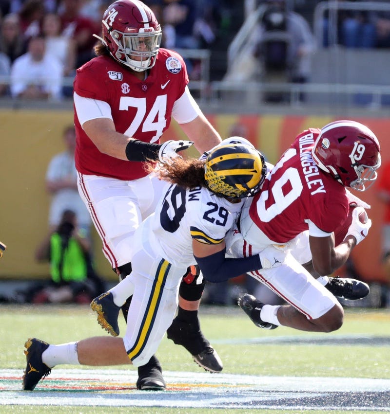 Alabama's Jedrick Wills Jr. (74) watches as Michigan's Jordan Glasgow tackles Alabama's Jahleel Billingsley during the Citrus Bowl, Jan. 1, 2020 in Orlando, Fla.