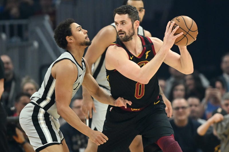 Mar 8, 2020; Cleveland, Ohio, USA; Cleveland Cavaliers forward Kevin Love (0) holds the ball as San Antonio Spurs guard Bryn Forbes (11) defends during the first half at Rocket Mortgage FieldHouse. Mandatory Credit: Ken Blaze-USA TODAY Sports