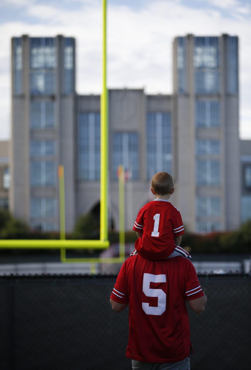 Ohio State fan Owen Nelms, 3, of Indianapolis, sits atop his dad, Brandon, before a NCAA Division I football game between the Indiana Hoosiers and the Ohio State Buckeyes on Saturday, September 14, 2019 at Memorial Stadium in Bloomington, Indiana.