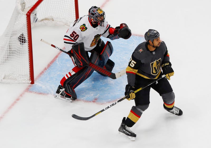 Blackhawks goalie Corey Crawford, left