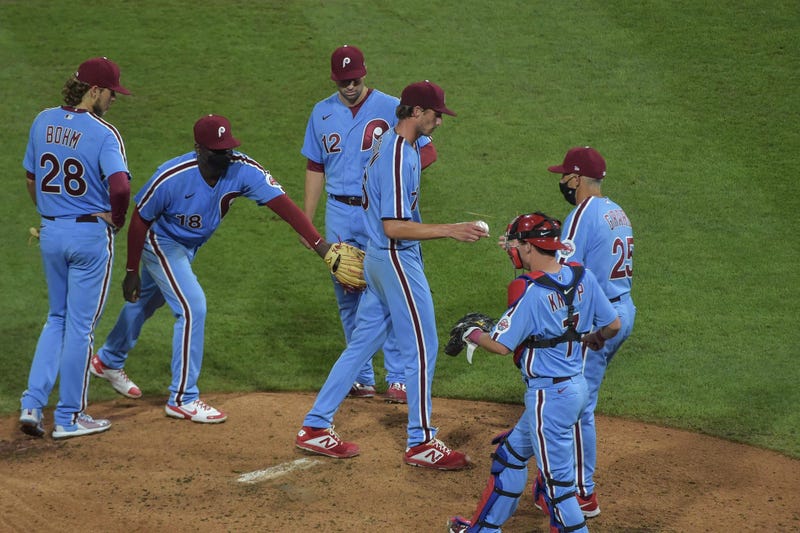 Philadelphia Phillies relief pitcher Connor Brogdon (75) hands the ball to manager Joe Girardi after being taken out of his first major league game during the ninth inning of the game against the Baltimore Orioles at Citizens Bank Park.