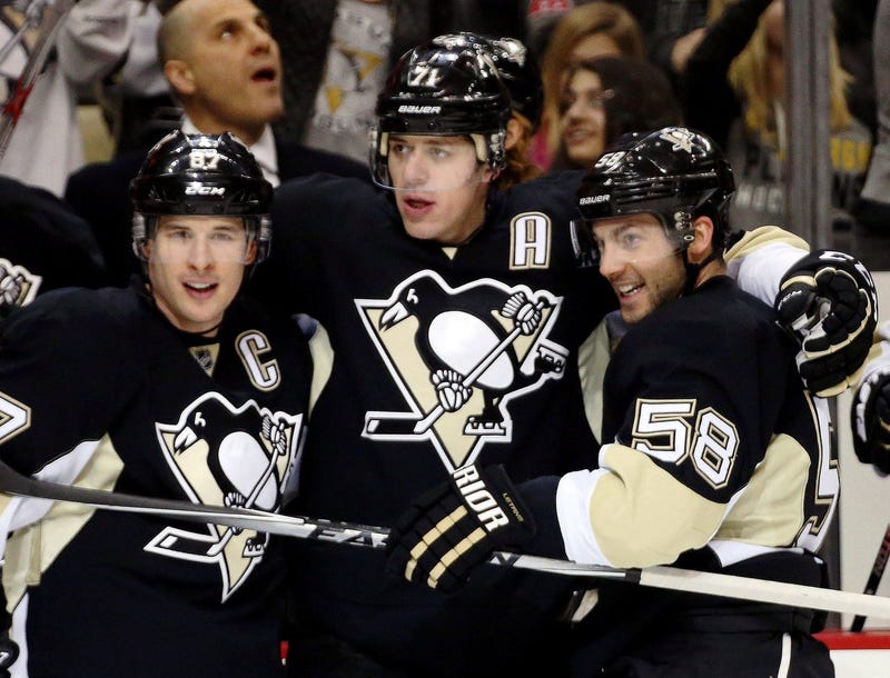 Pittsburgh Penguins center Sidney Crosby (87) and center Evgeni Malkin (71) and defenseman Kris Letang