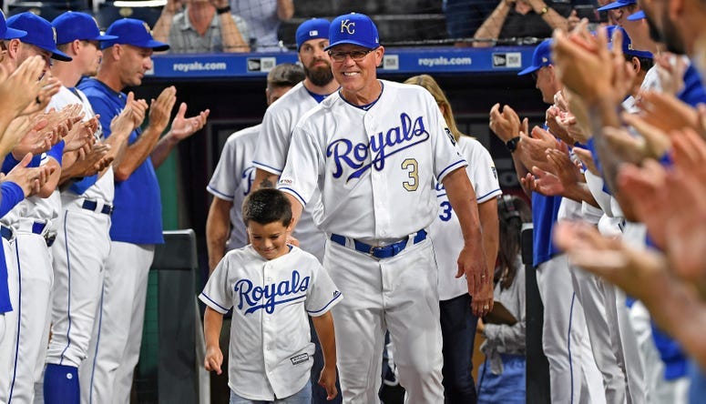 Kansas City Royals manager Ned Yost (3) walks out onto the field with his family before being honored, prior to a game against the Minnesota Twins at Kauffman Stadium.