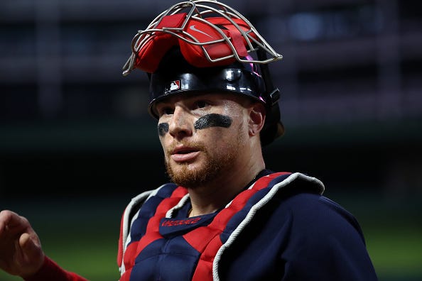 Christian Vazquez glances back to the Red Sox dugout.