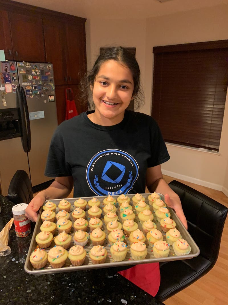 Vedika Jawa, 16, poses with a tray of desserts