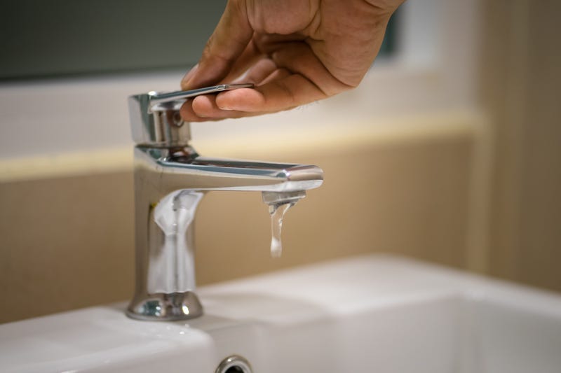 Water returns to Dixmoor, allowing residents to bathe but not consume