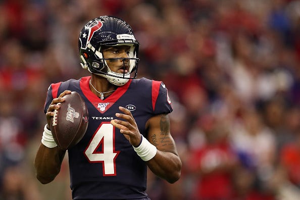 Texans QB Deshaun Watson eyes his receivers during a game.