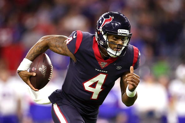 Deshaun Watson rushes with the ball for a Texans TD.