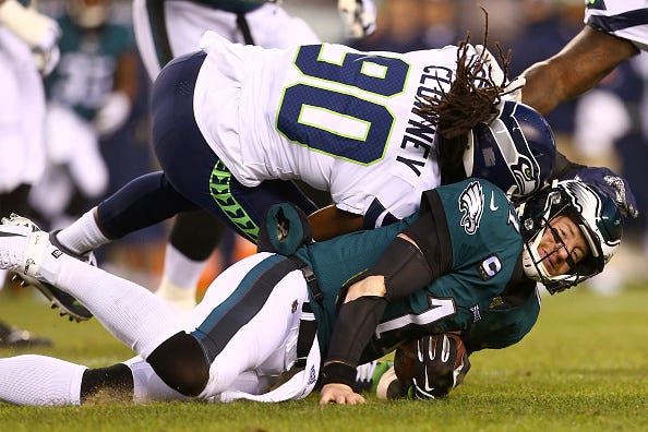Eagles QB Carson Wentz takes a helmet-to-helmet hit.