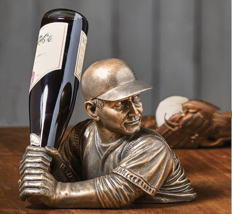 A baseball player wine holder.