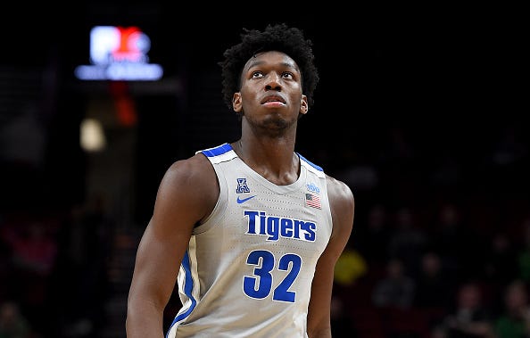 Memphis star James Wiseman looks on during a game from the court.