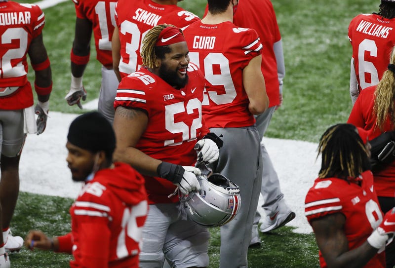 Ohio State OL Wyatt Davis joins his teammates on the sideline.