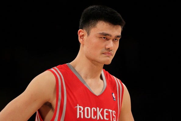 Yao Ming glares across the court with the Rockets.