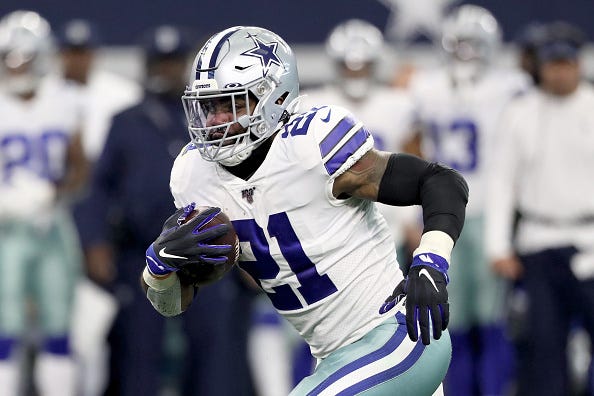 Ezekiel Elliott bursts down field in a game for the Cowboys.