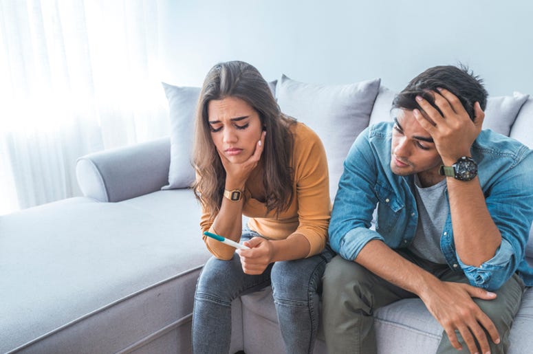 Couple Looking at Pregnancy Test